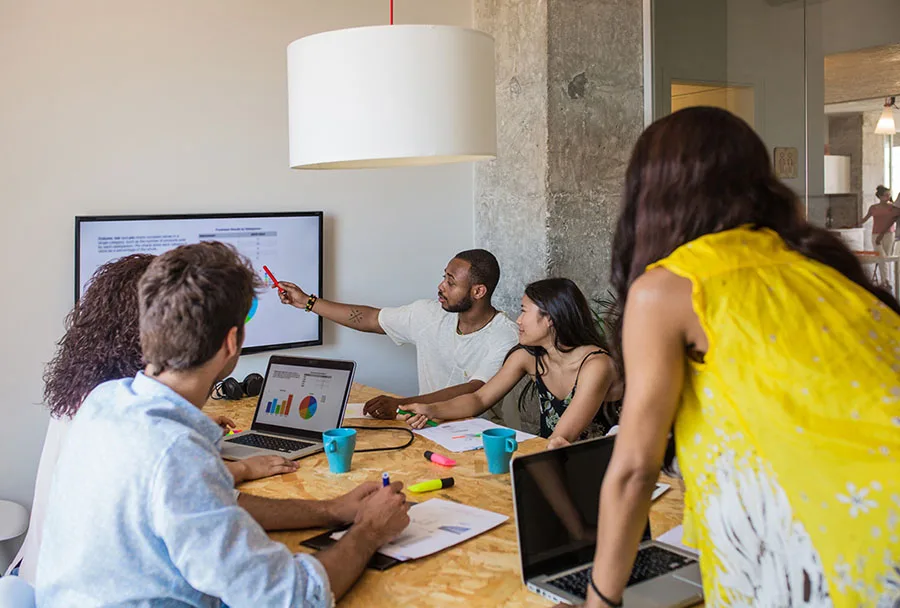 Multiple coworkers in a conference room setting