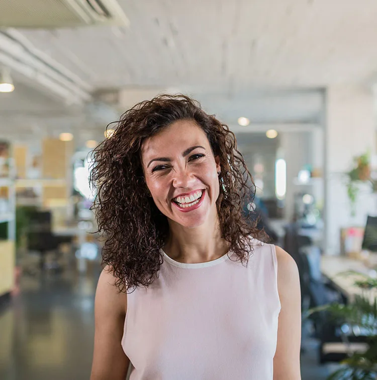 A happy woman looking at the camera